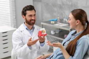 Happy patient with dental implants in Scarsdale