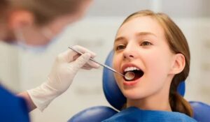 Pediatric dentist applying dental sealants as part of preventive dentistry in Palo Alto.
